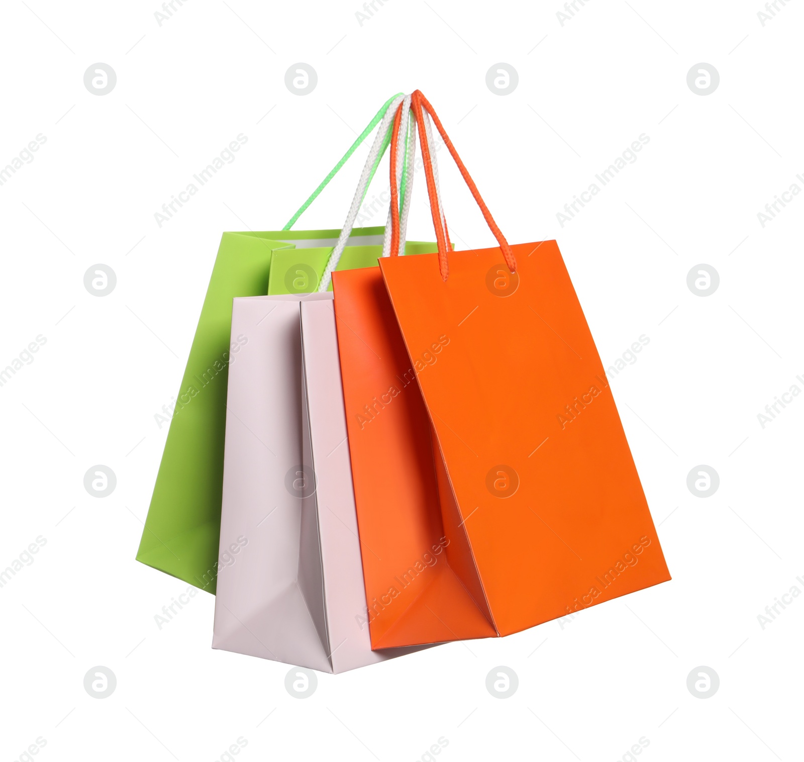 Photo of Colorful paper shopping bags isolated on white