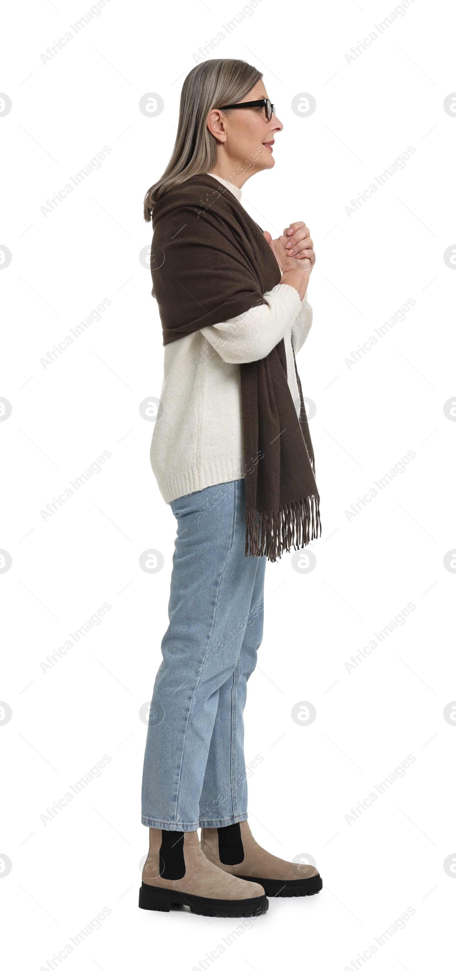 Photo of Full length portrait of senior woman on white background