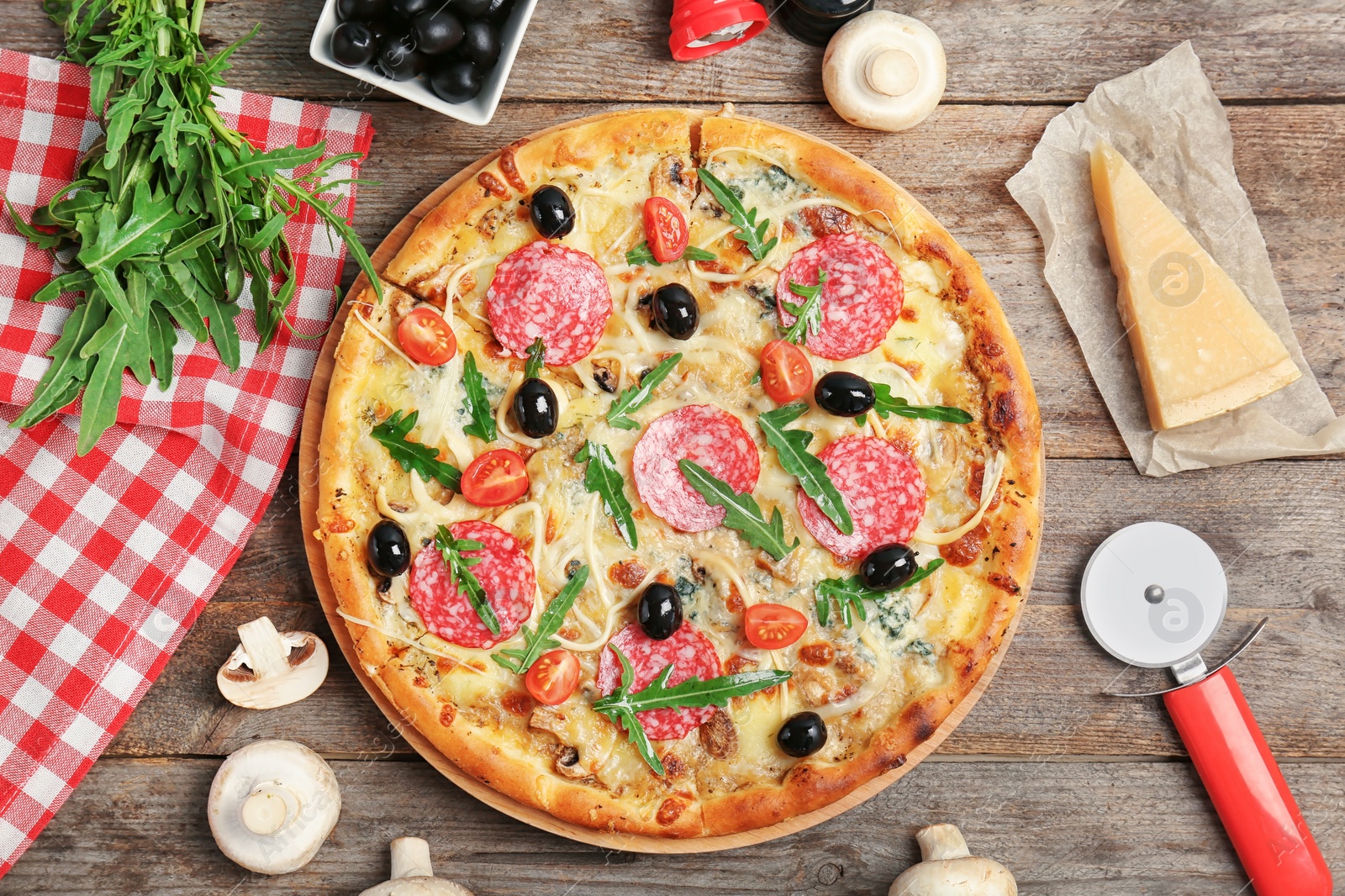 Photo of Flat lay composition with delicious pizza and ingredients on table