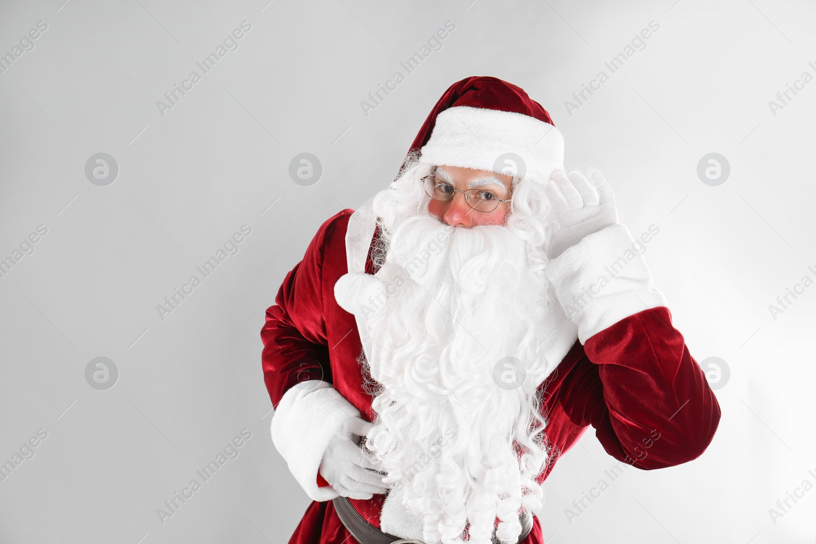 Photo of Portrait of Santa Claus on light grey background