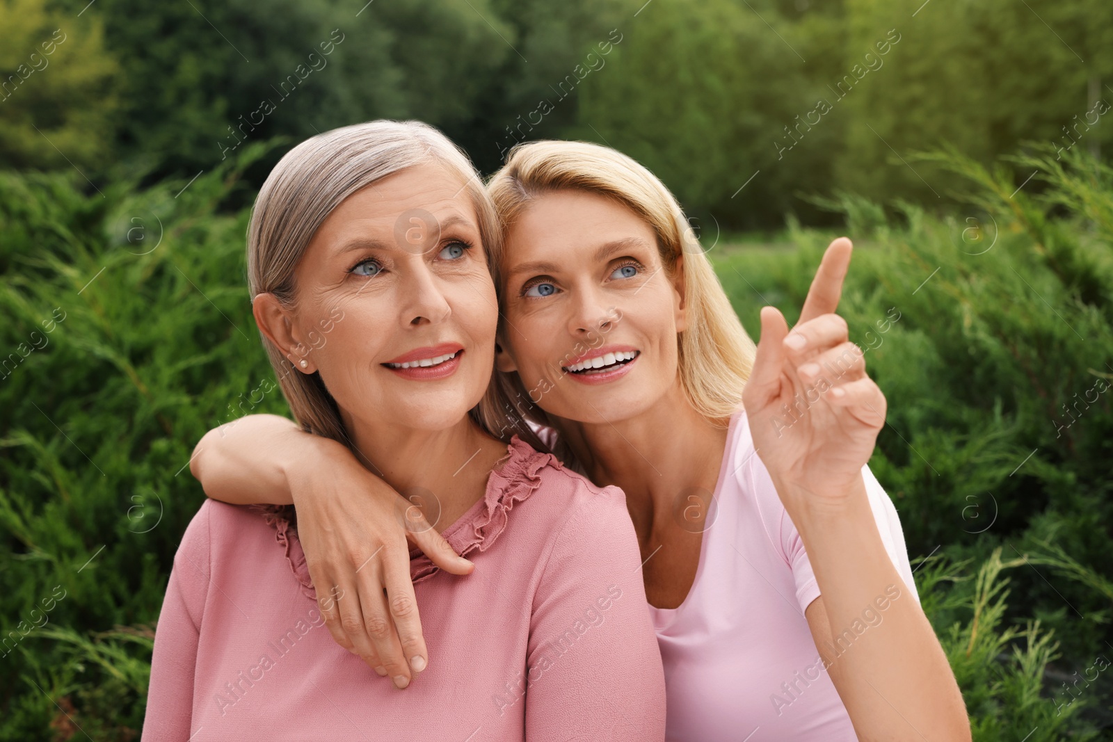 Photo of Happy mature mother and her daughter outdoors