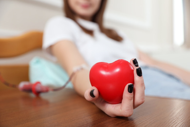 Teenager donating blood in hospital, closeup view