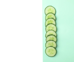 Photo of Flat lay composition with cut cucumber on color background