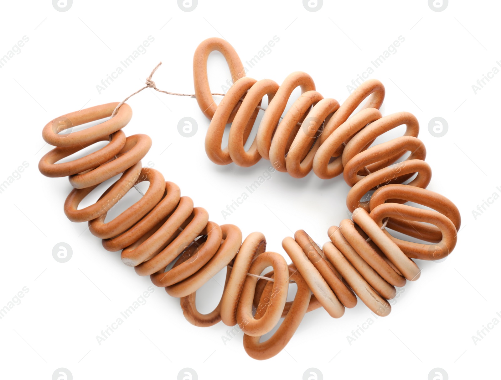 Photo of Bunch of delicious ring shaped Sushki (dry bagels) on white background, top view