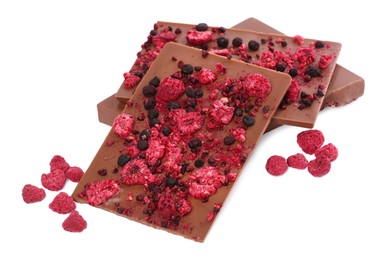 Chocolate bars with freeze dried berries on white background