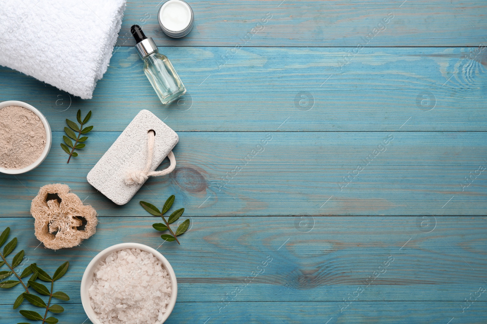 Photo of Flat lay composition with pumice stone on turquoise wooden background. Space for text