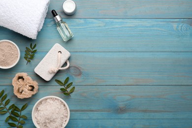 Photo of Flat lay composition with pumice stone on turquoise wooden background. Space for text