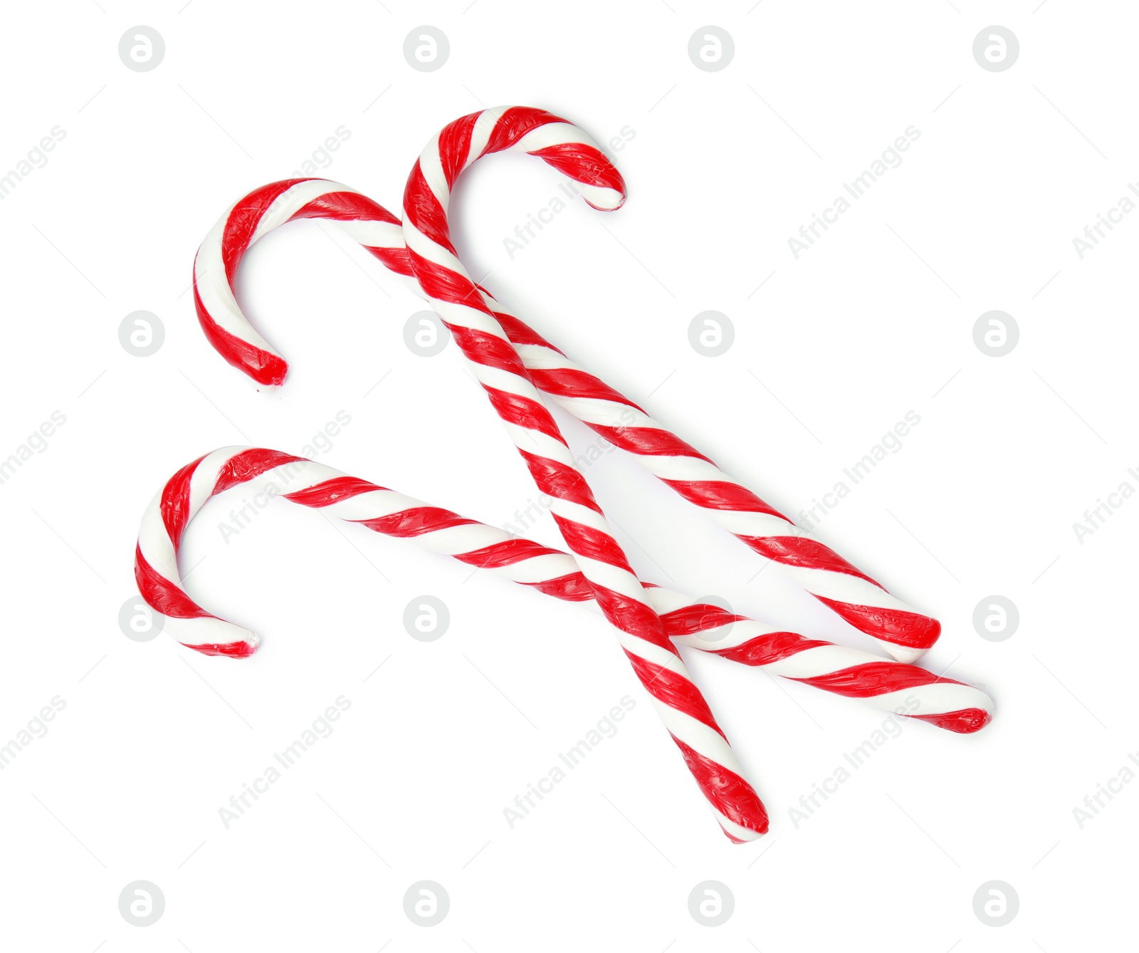 Photo of Tasty candy canes on white background. Festive treat