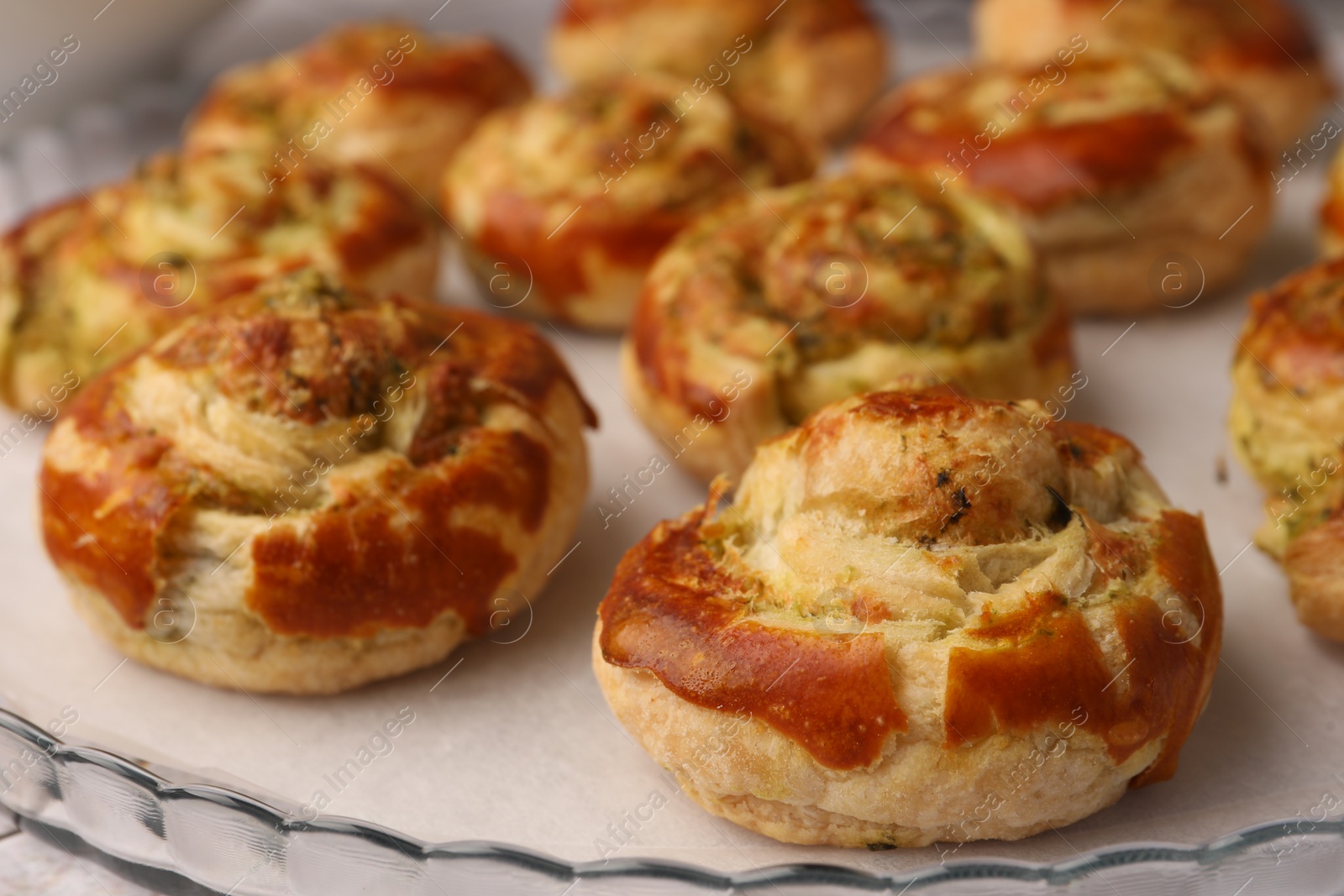 Photo of Fresh delicious puff pastry with tasty filling on tray, closeup