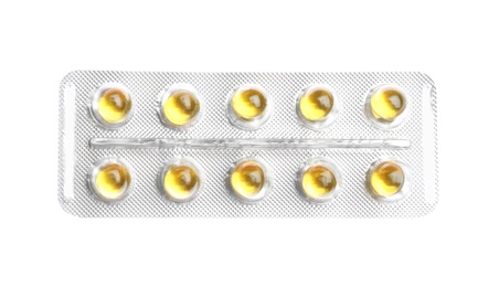 Photo of Pills in blister pack on white background, top view