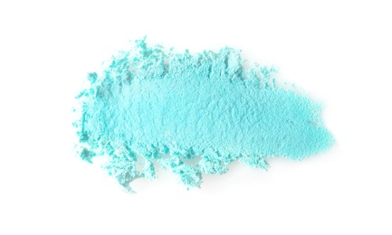 Photo of Crushed eye shadow on white background. Professional makeup products