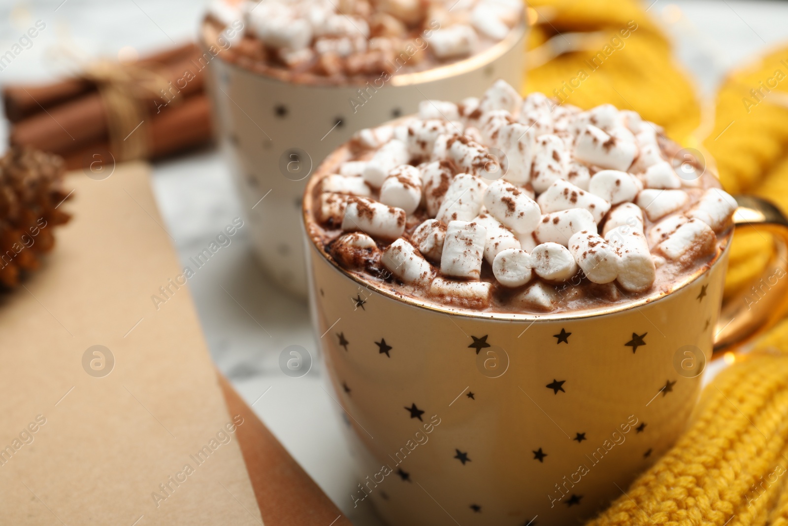 Photo of Cup of delicious hot cocoa with marshmallows on white table, closeup