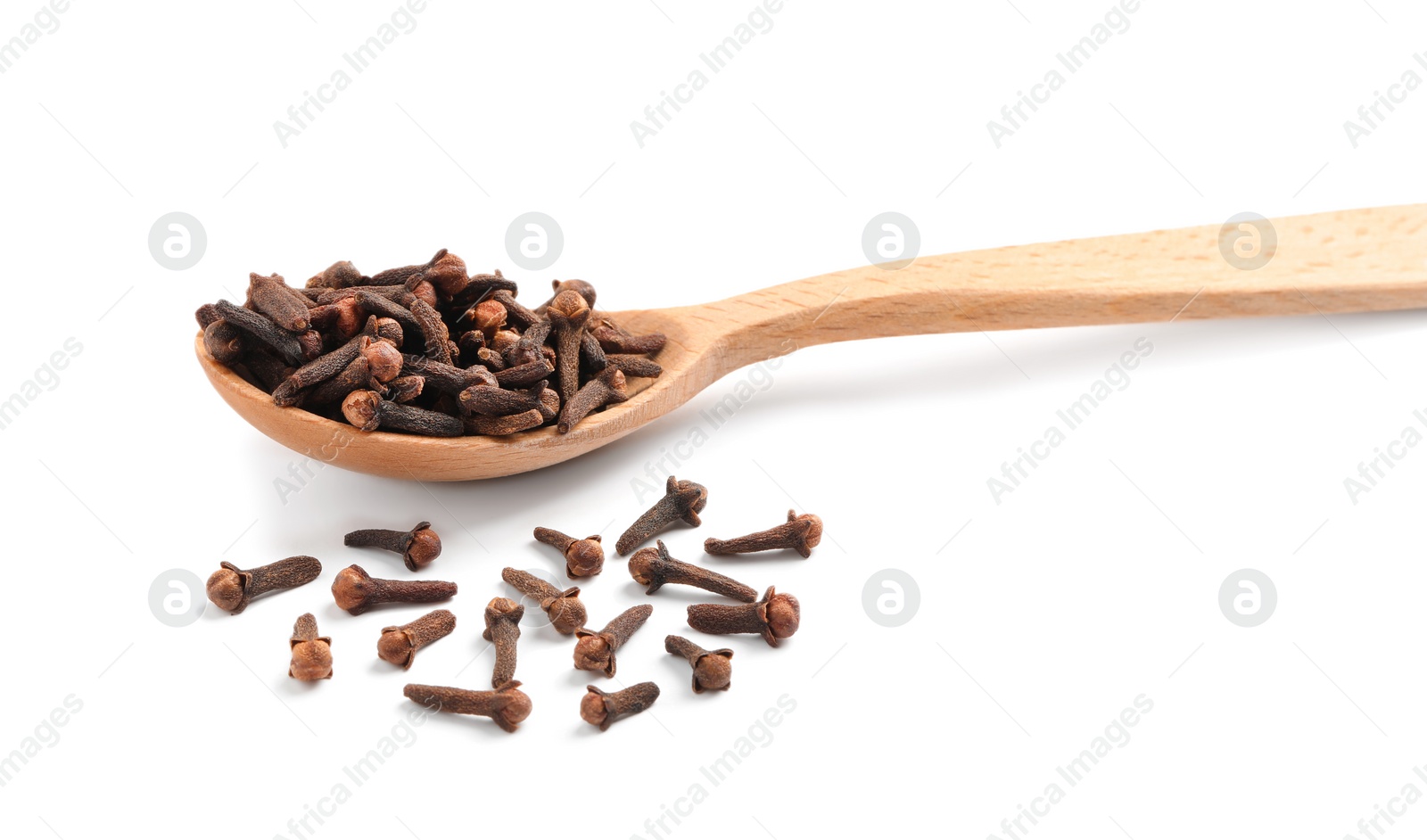 Photo of Aromatic dry cloves and wooden spoon on white background