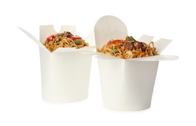 Photo of Boxes of wok noodles with vegetables and meat isolated on white