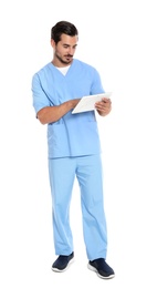 Photo of Young male doctor in uniform with tablet on white background. Medical service