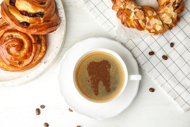 Coffee causing dental problem. Cup of hot drink and pastries on white wooden table, flat lay