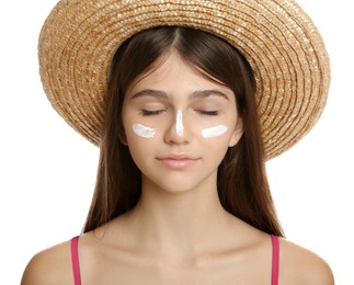 Teenage girl with sun protection cream on her face against white background