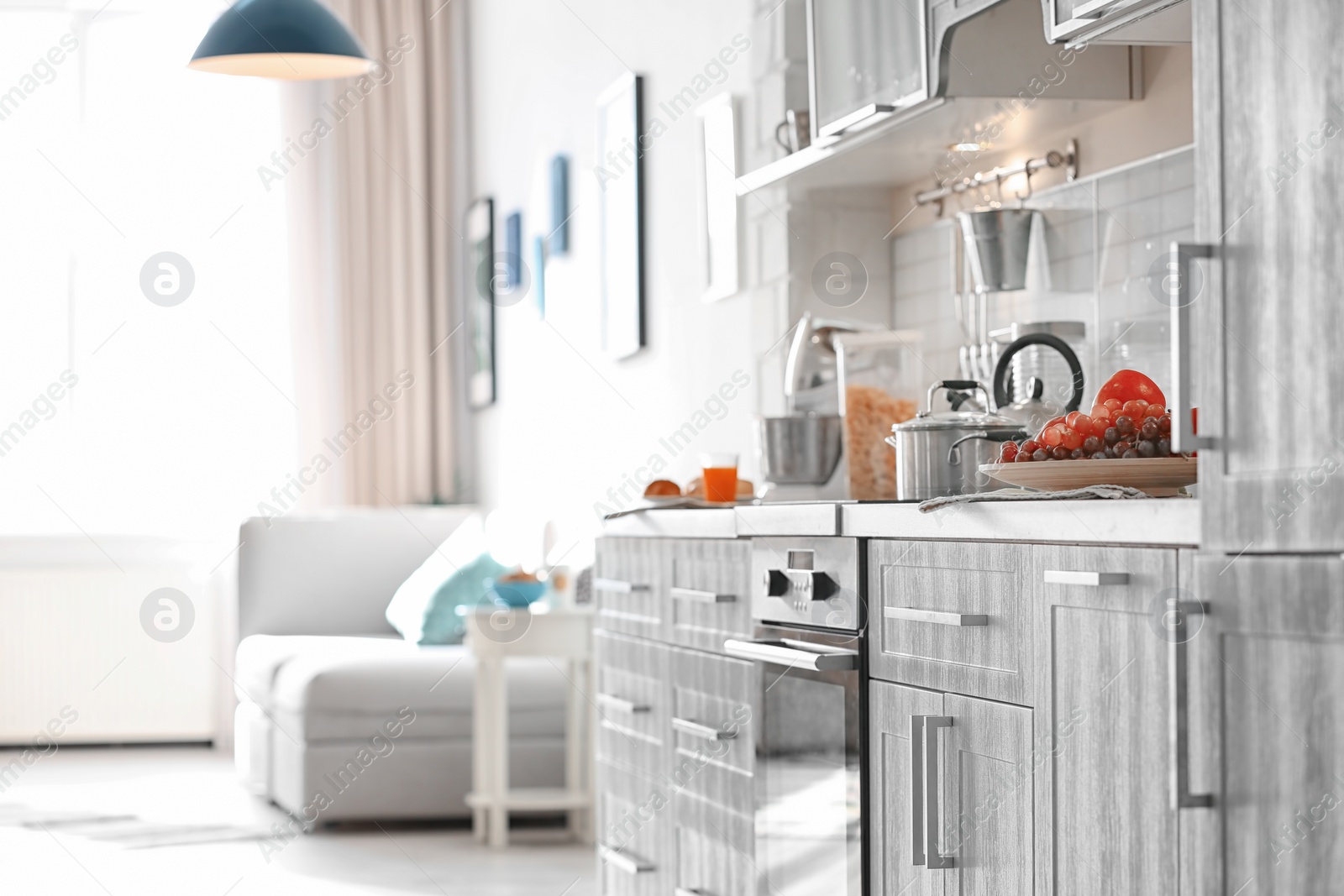 Photo of Modern kitchen interior in light apartment