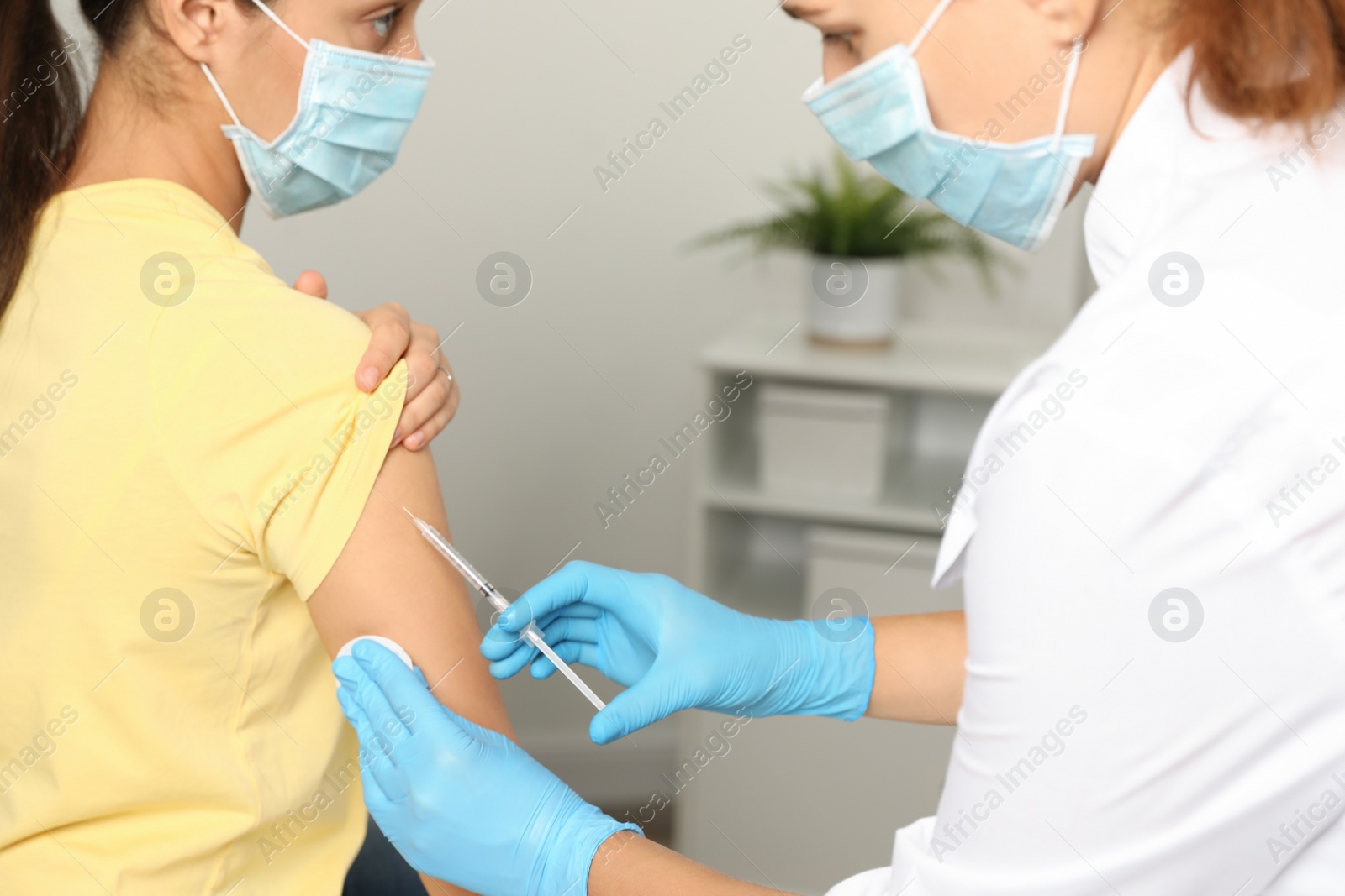 Photo of Doctor giving injection to patient in hospital, closeup. Vaccination day