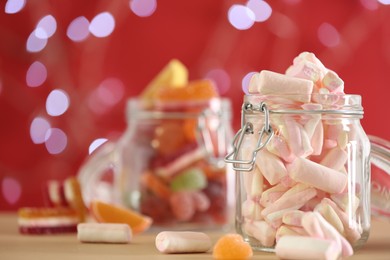 Delicious marshmallows on table against blurred background, closeup