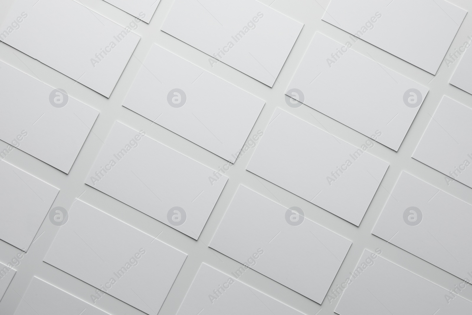 Photo of Blank business cards on white background, flat lay. Mockup for design