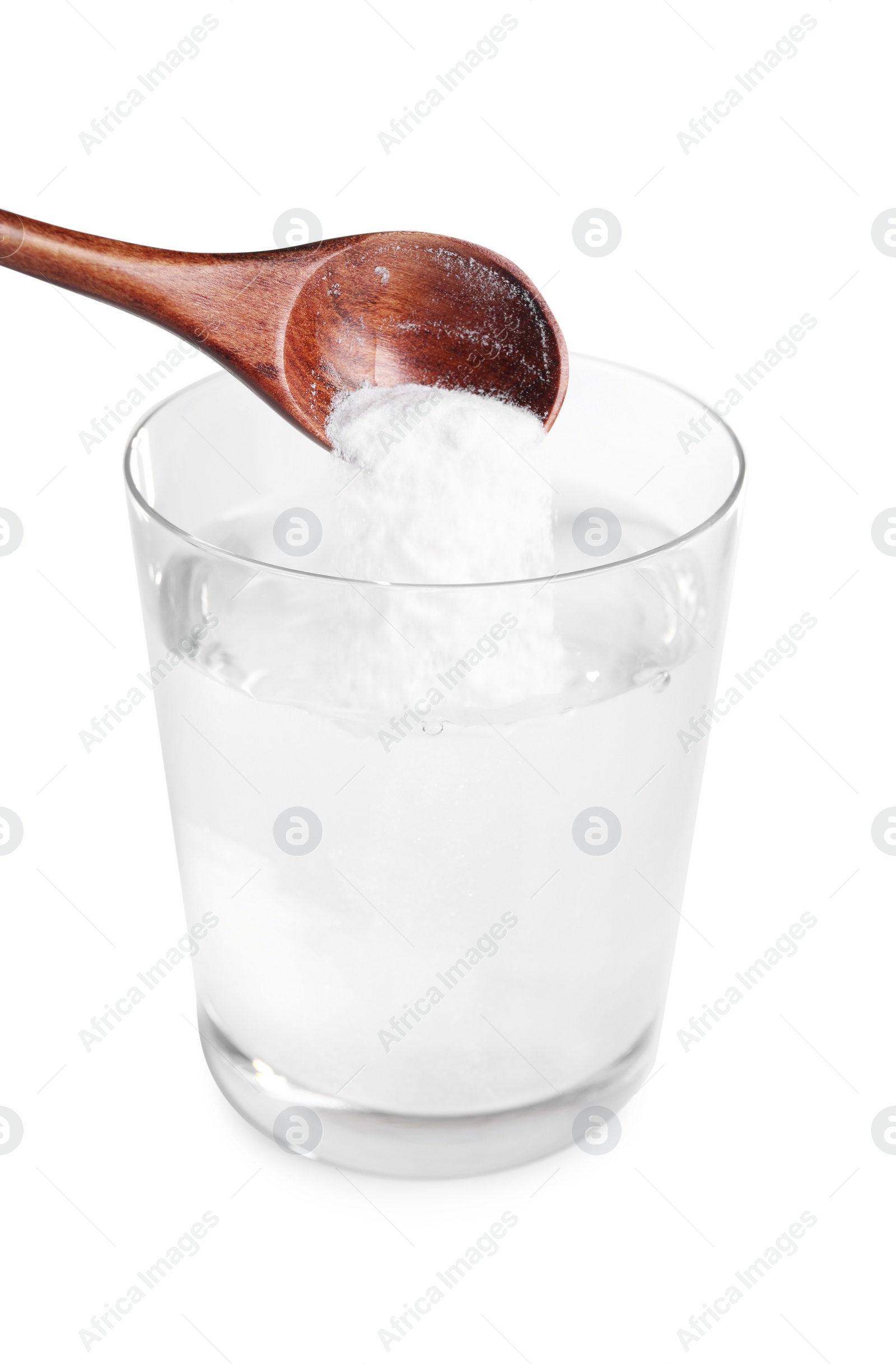 Photo of Adding baking soda into glass of water on light background