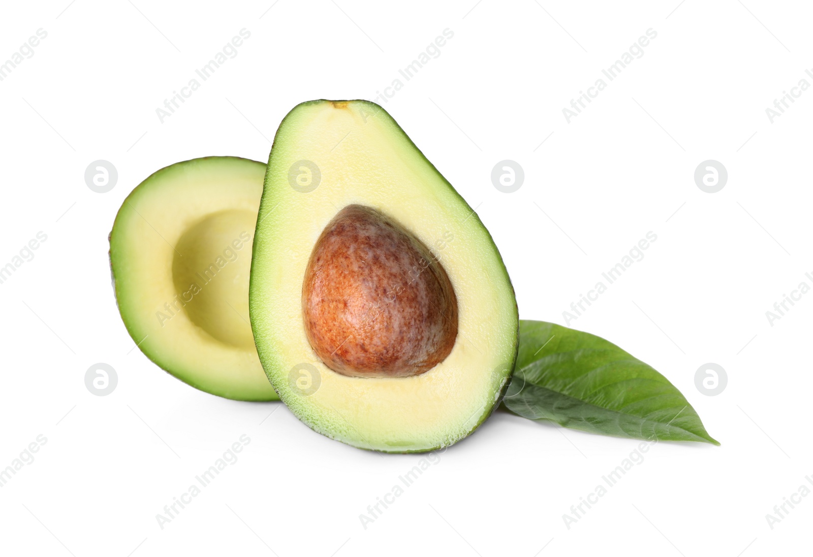 Photo of Halves of ripe avocado isolated on white