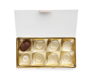 Partially empty box of chocolate candies isolated on white, top view