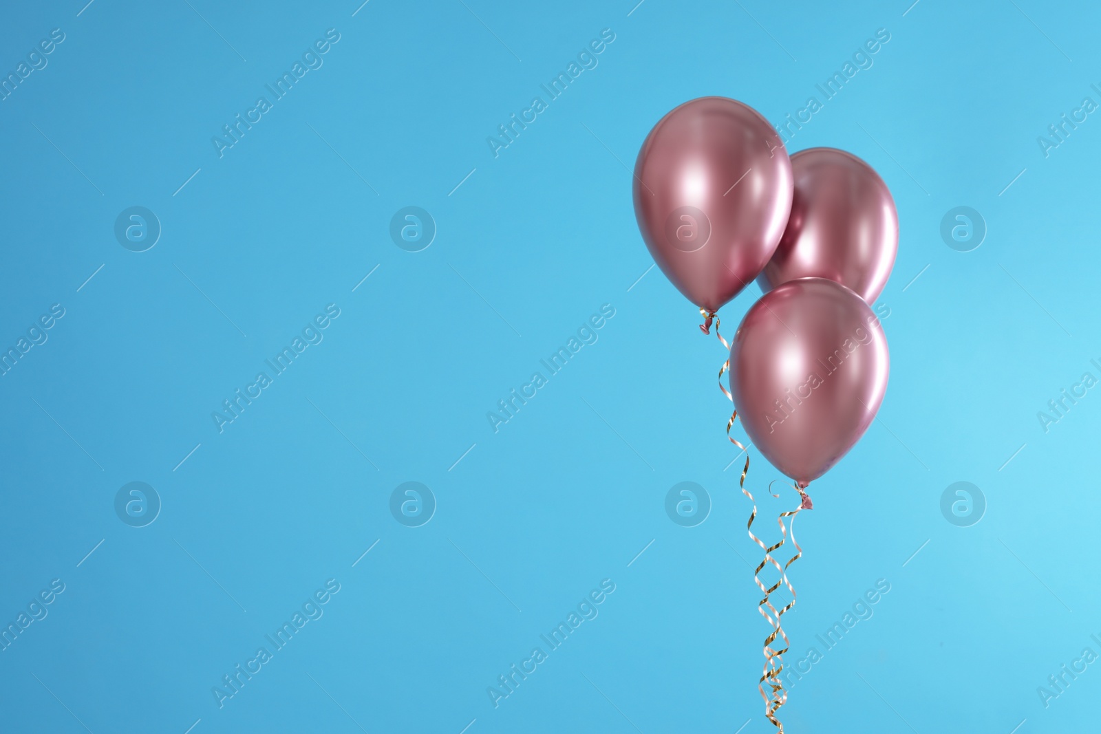 Photo of Bright balloons on color background. Space for text