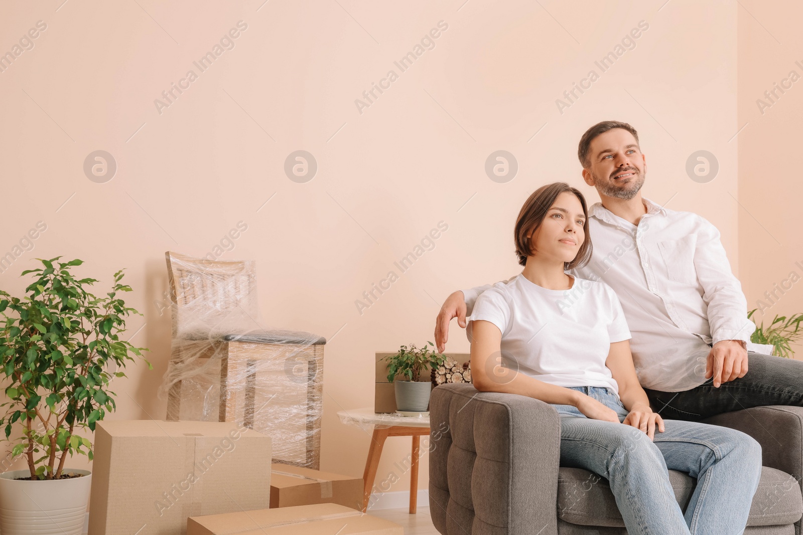 Photo of Happy couple in new apartment. Moving day