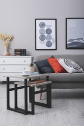 Photo of Stylish grey living room interior with comfortable sofa