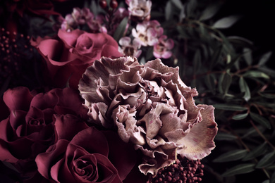 Photo of Beautiful bouquet of different flowers on black background, closeup. Floral card design with dark vintage effect