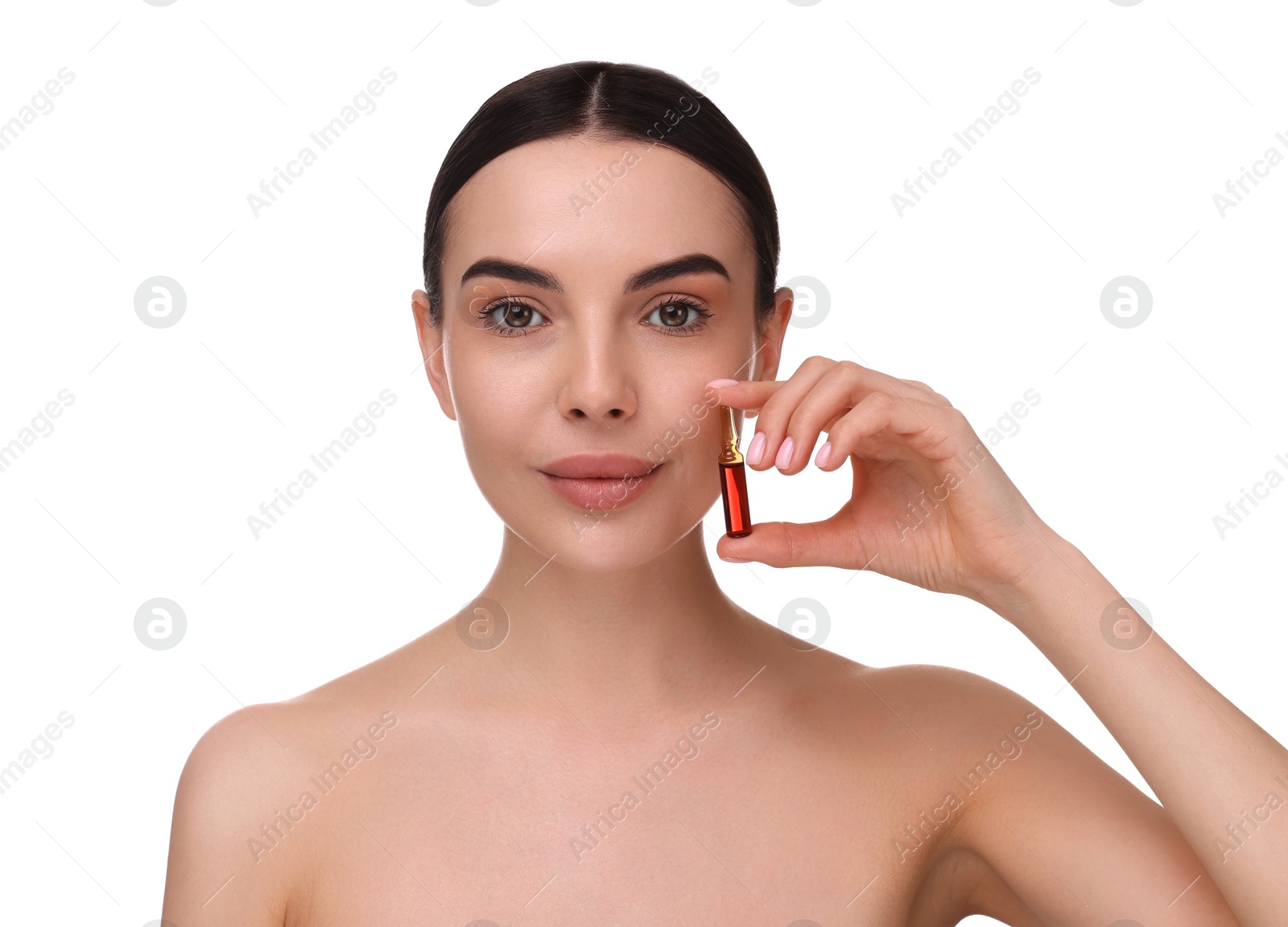 Photo of Beautiful young woman holding skincare ampoule on white background