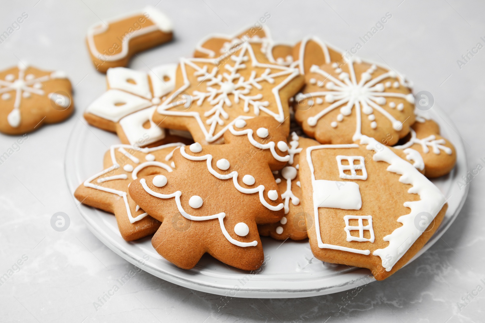 Photo of Plate with tasty homemade Christmas cookies on table