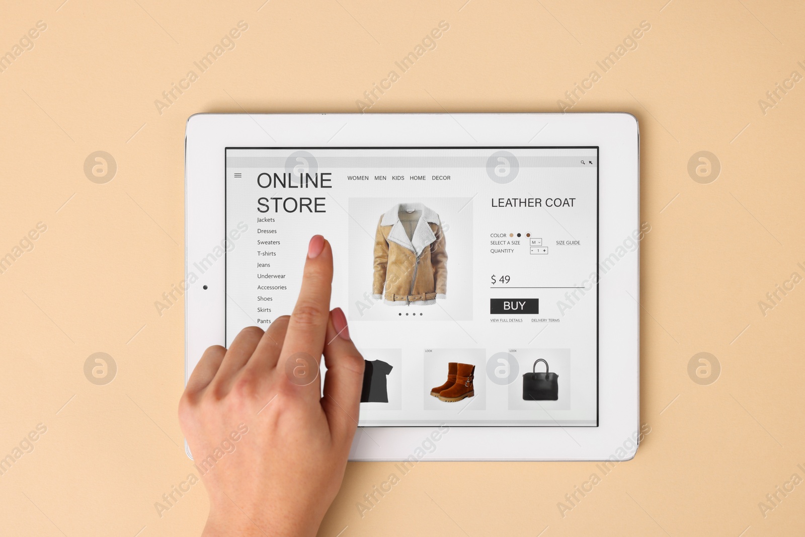 Photo of Woman with tablet shopping online on beige background, top view