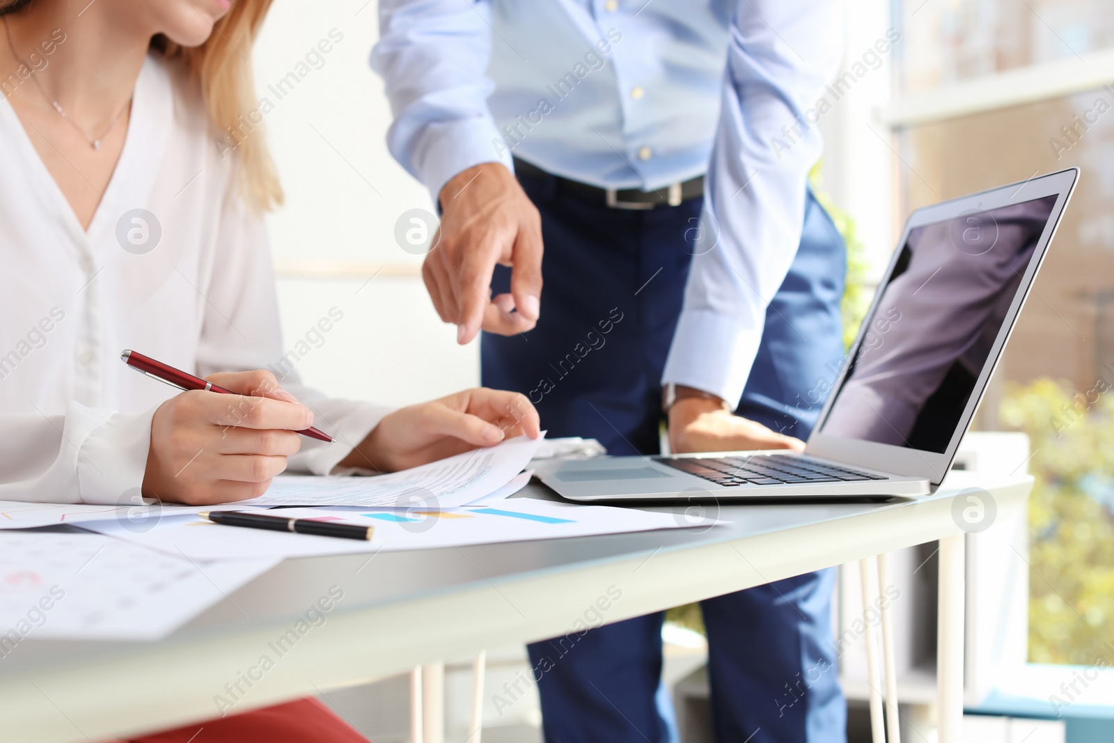 Photo of Tax accountants working with documents at table