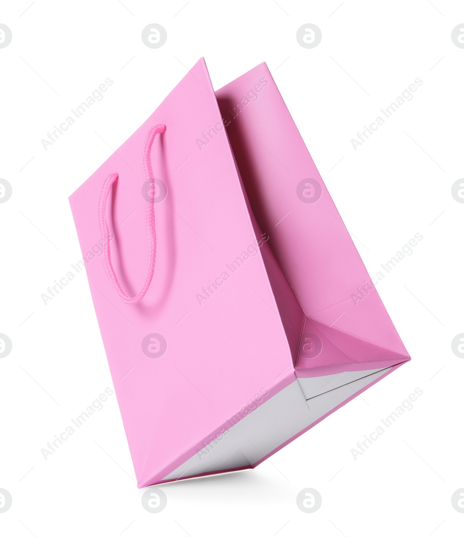 Photo of One pink shopping bag isolated on white