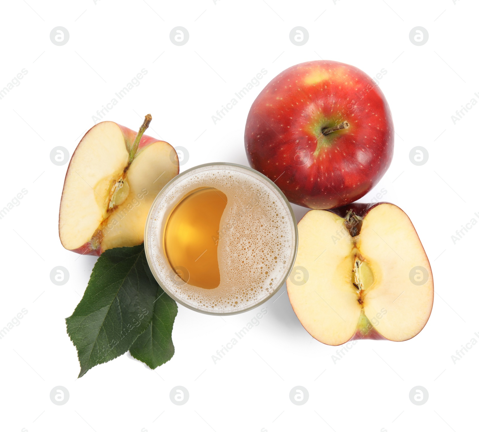 Photo of Delicious cider in glass near ripe apples on white background, top view