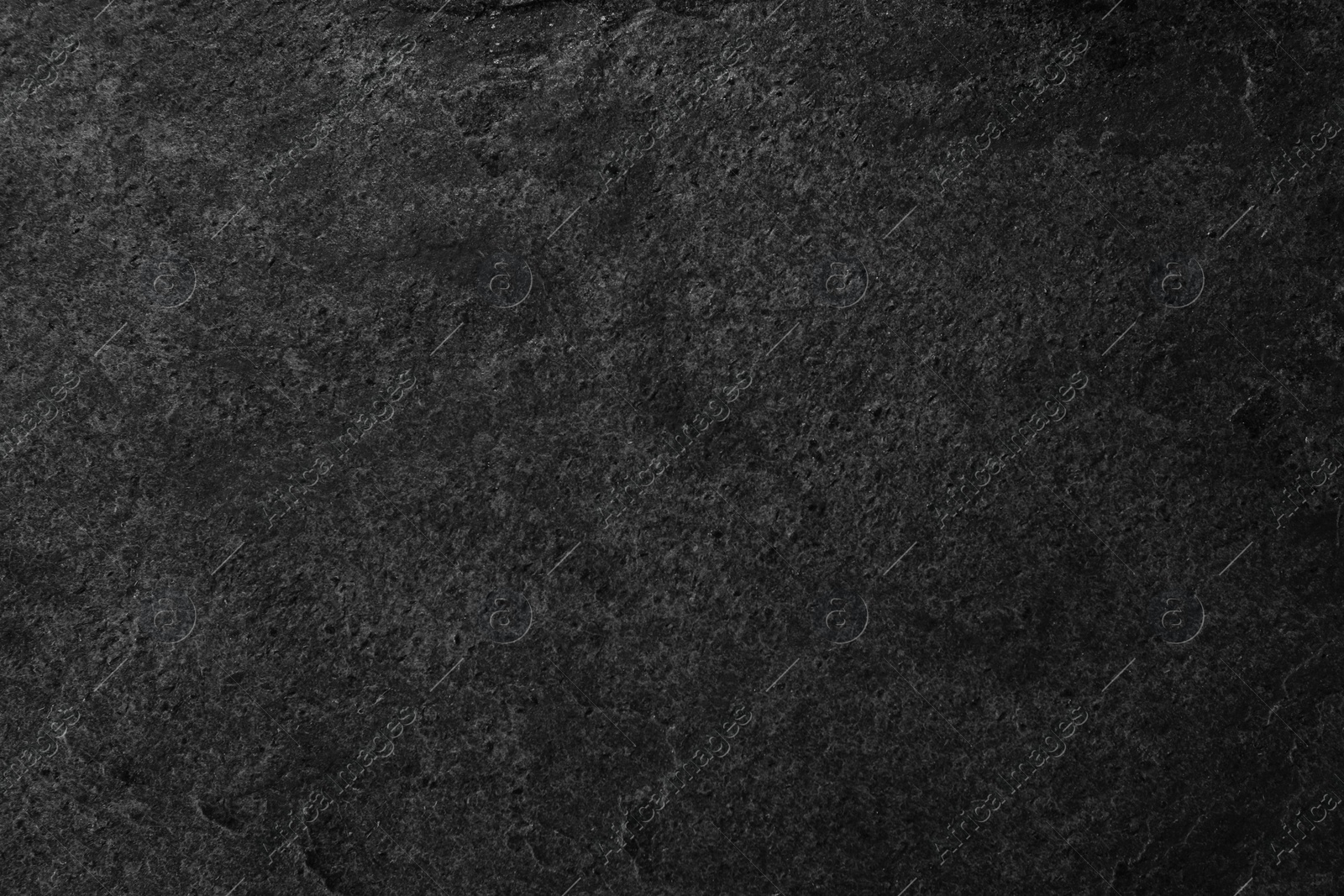 Image of Texture of dark grey stone surface as background, closeup