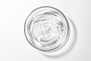 Petri dish with liquid on white background, top view