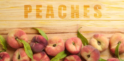 Fresh flat peaches on wooden table, top view. Banner design