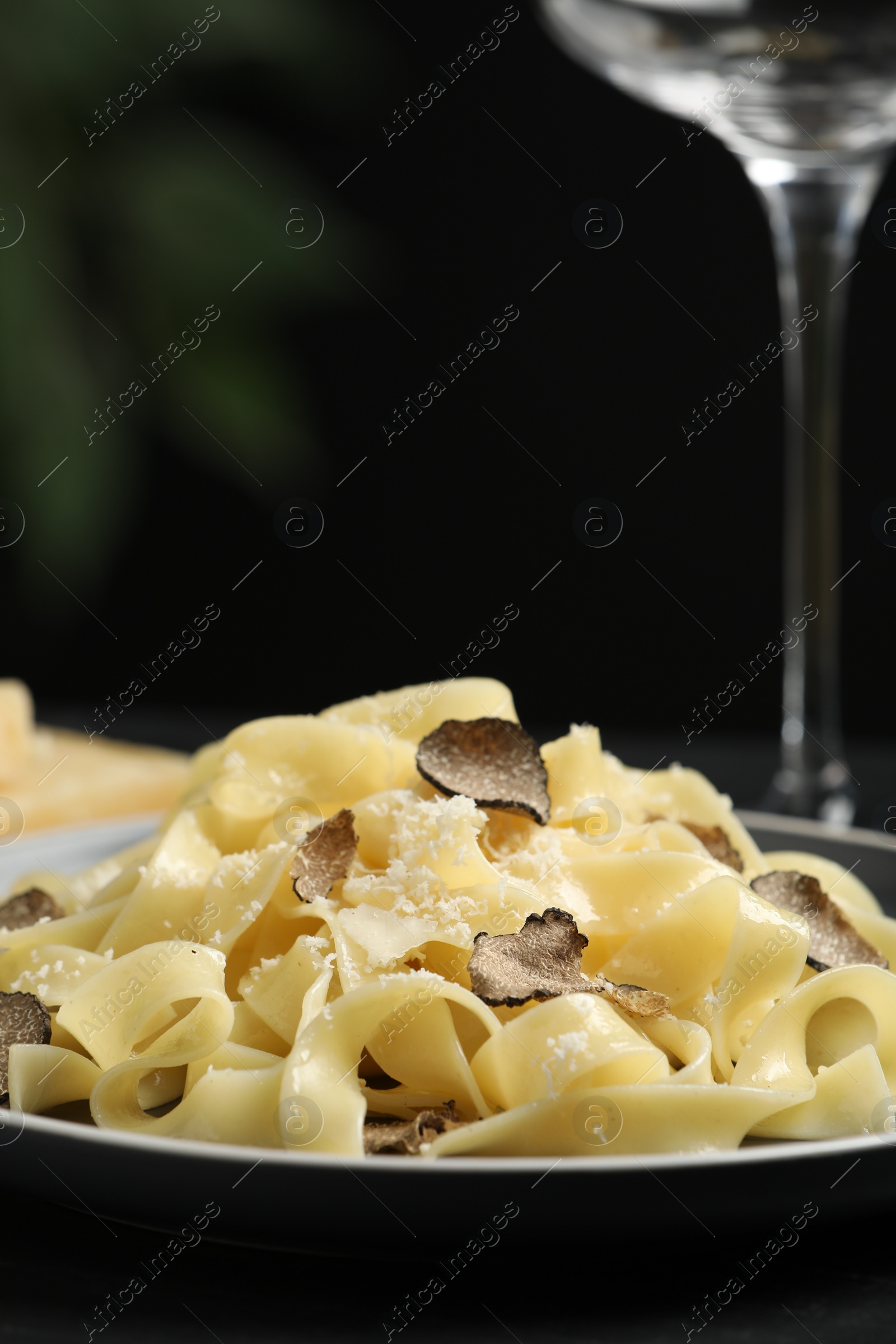 Photo of Tasty tagliatelle with truffle on table, closeup
