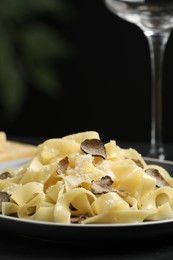 Photo of Tasty tagliatelle with truffle on table, closeup