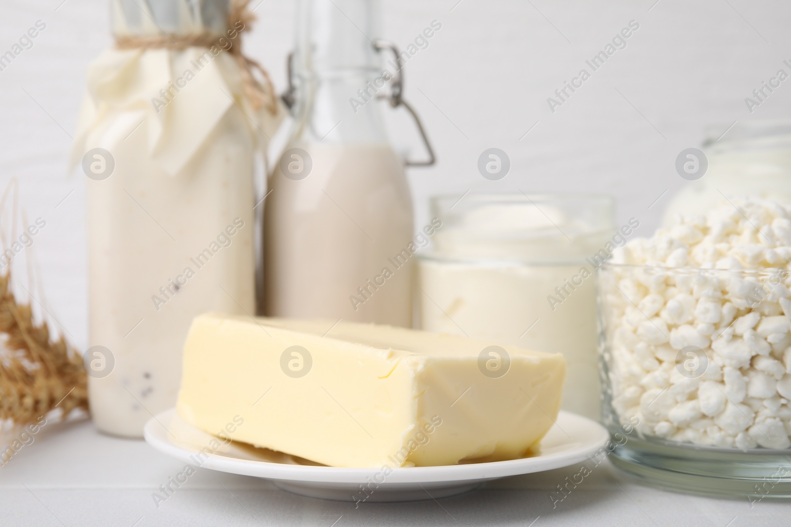 Photo of Different fresh dairy products on white table