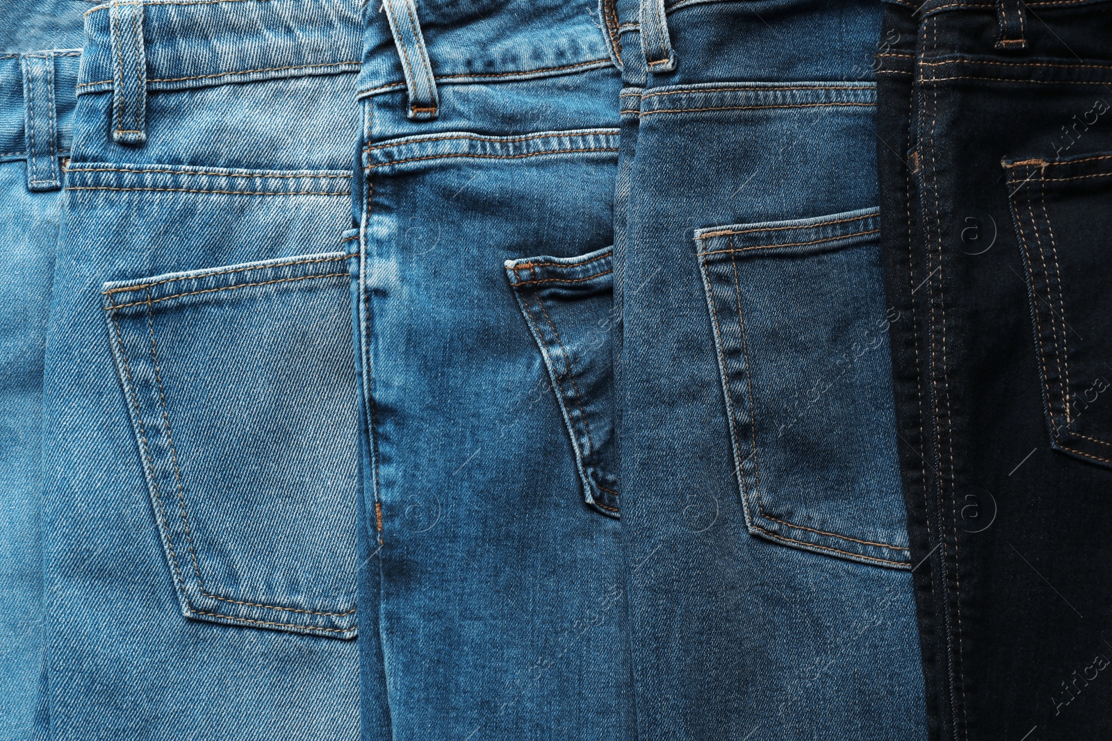 Photo of Jeans of different colors as background