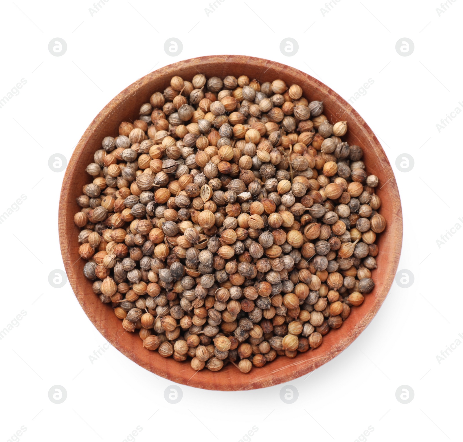 Photo of Wooden bowl of coriander grains on white background, top view