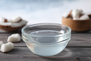 Coconut oil on wooden table, closeup view