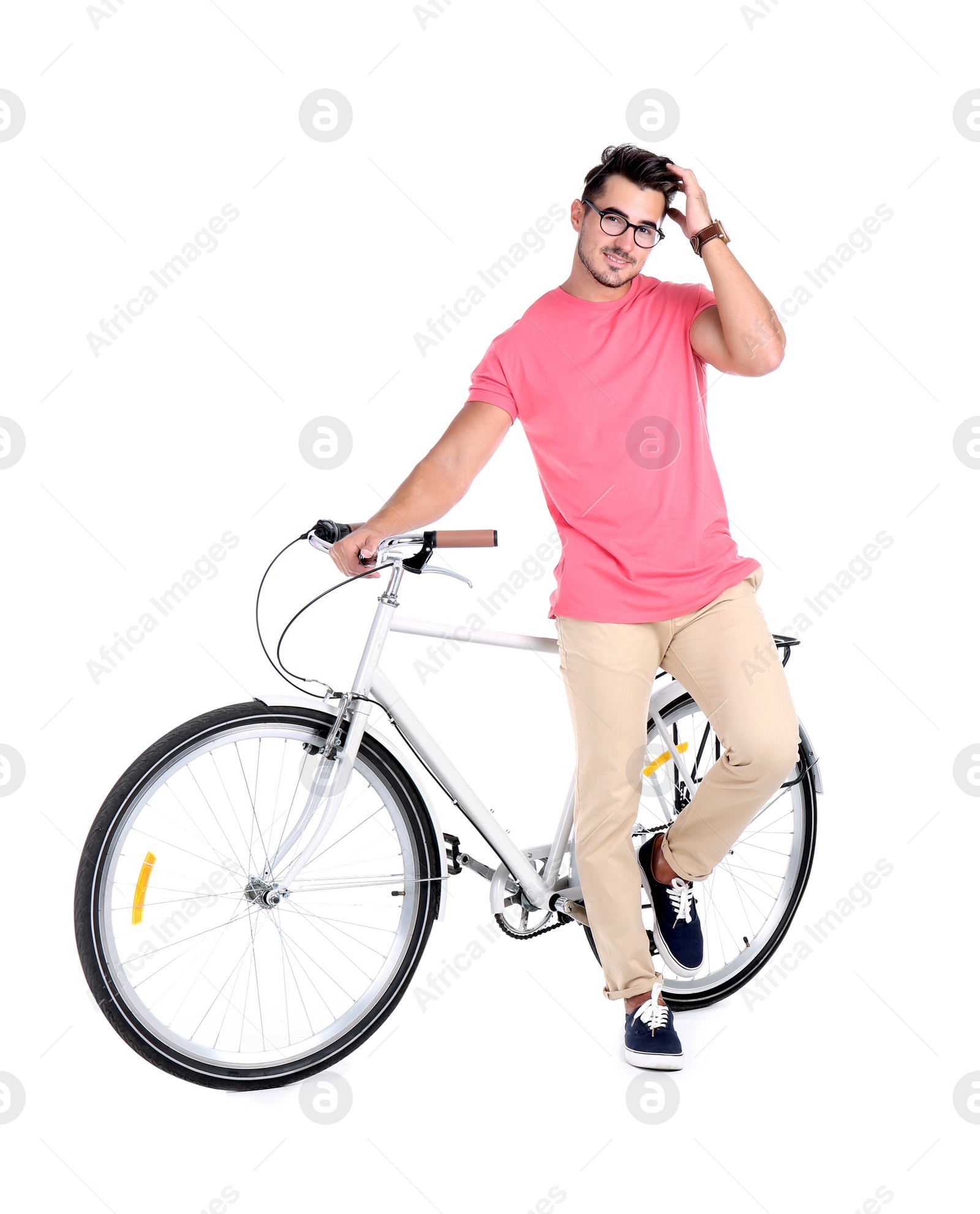 Photo of Handsome young hipster man with bicycle on white background