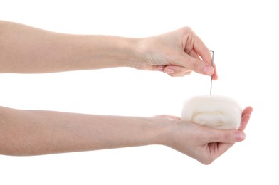 Photo of Woman needle felting from wool on white background, closeup