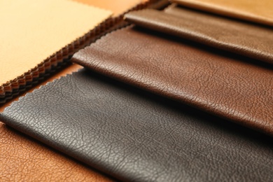 Leather samples of different colors for interior design on table